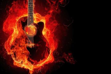 Guitar on fire. Fire is colored red. dark-rider-42019-unsplash