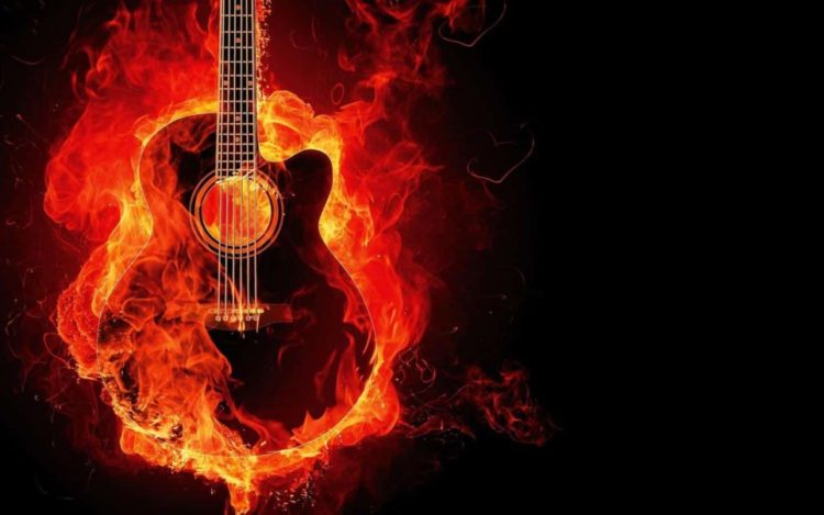 Guitar on fire. Fire is colored red. dark-rider-42019-unsplash