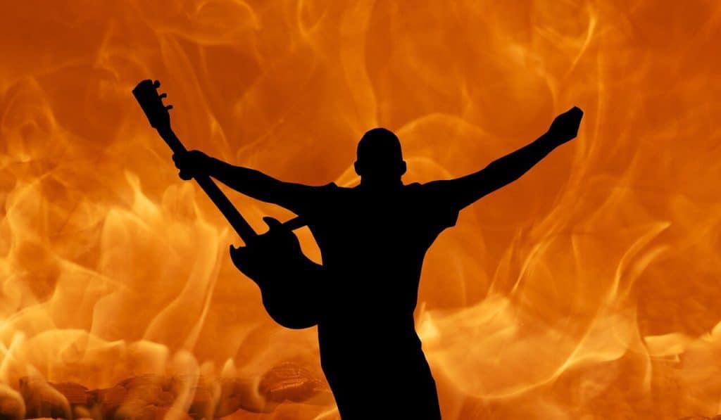 Fiery image of guitar and man