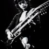 Jimmy Page playing guitar. Black and white picture.