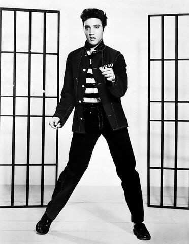 Elvis Presley dancing with hand extended. Vintage picture. Elvis Presley photo courtesy of pixabay.com