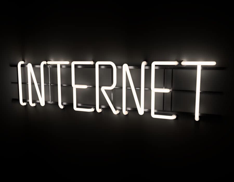 Internet sign, bright color light on a black background