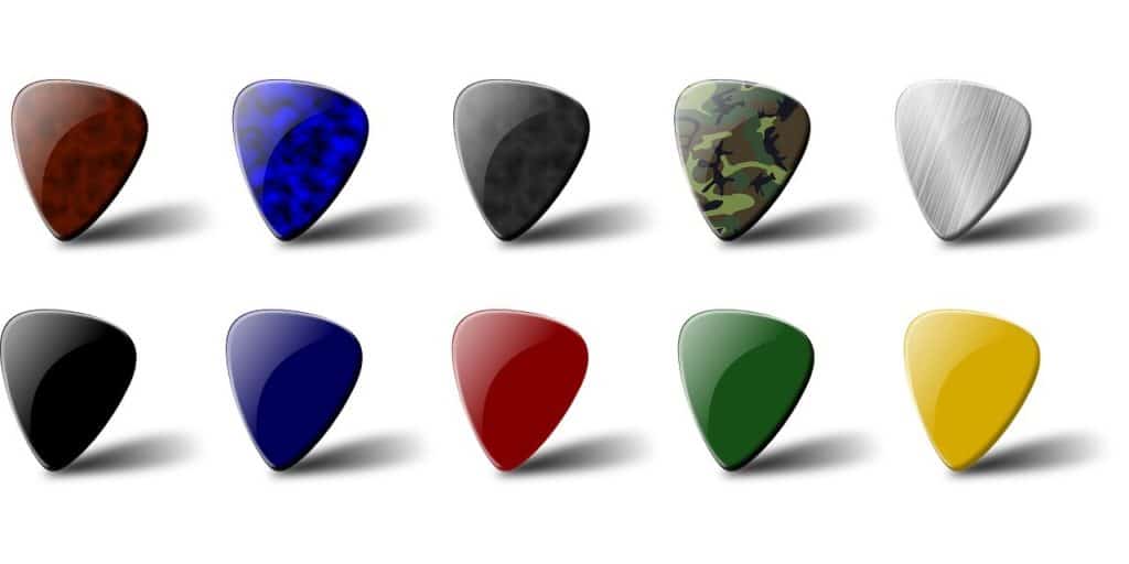 Different colored guitar picks. Red, yellow, blue, green, camouflage, etc.