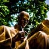 Bronze statue reading book. Photo from Unsplash.com