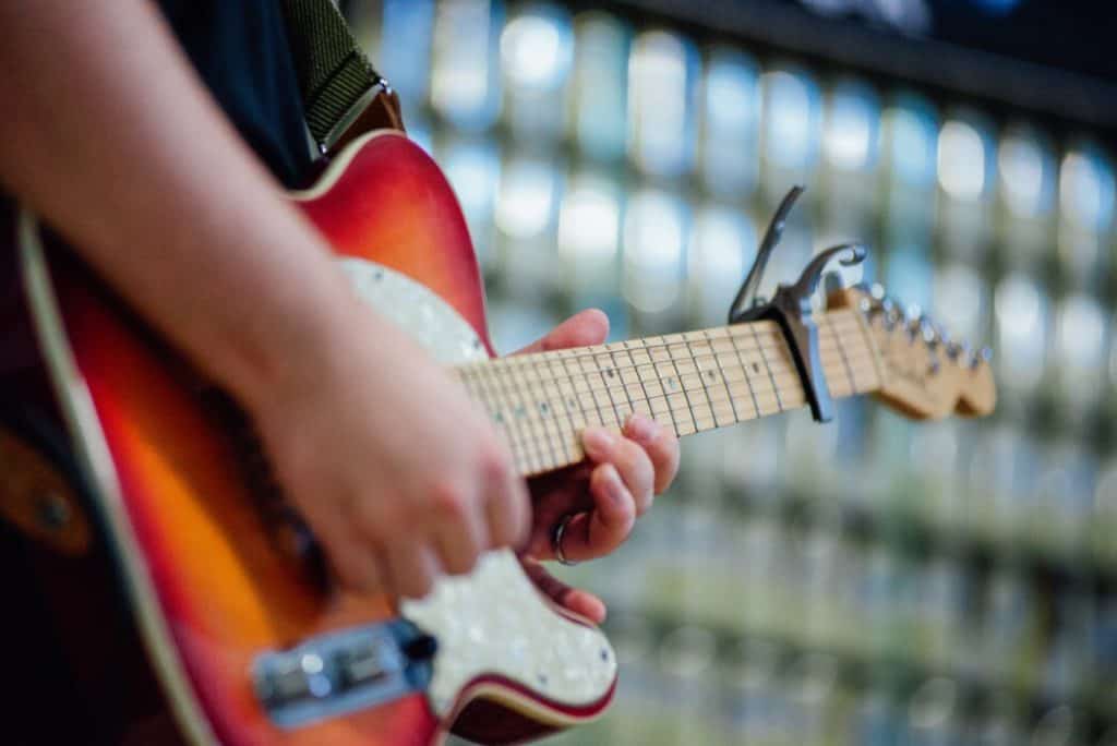 Guitar capo on the guitar. 