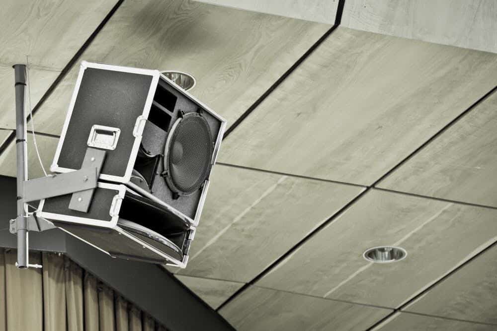 Big speaker mounted on building, outside.