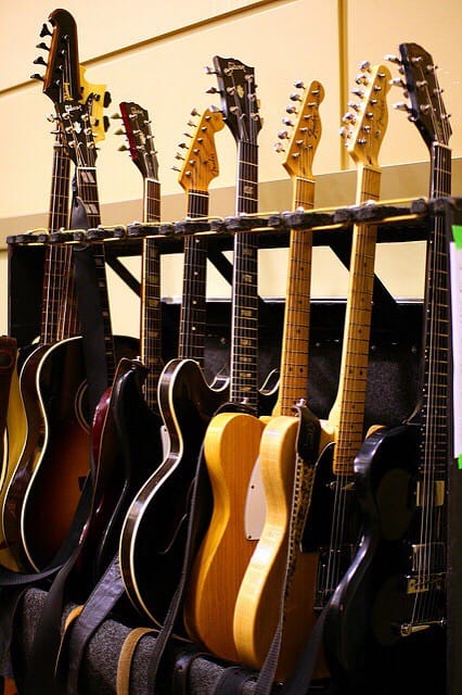 Various guitars on rack. Photo courtesy of Martin Cathrae from flickr.com