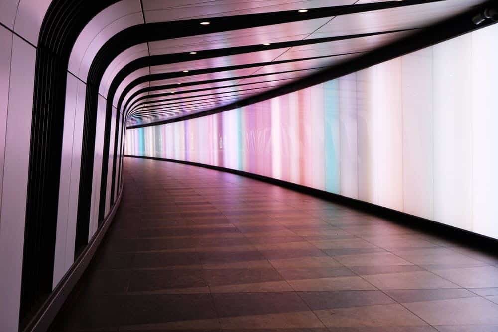 Silver kaleidoscope of other colors, curved hallway.