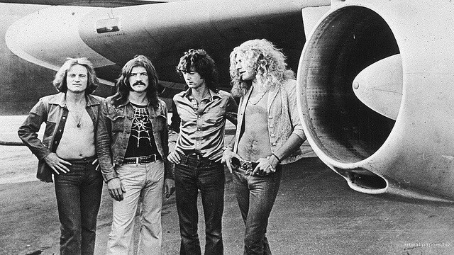 Led Zeppelin posing in front of airplane. Photo courtesy of Julio Zeppelin from flickr.com