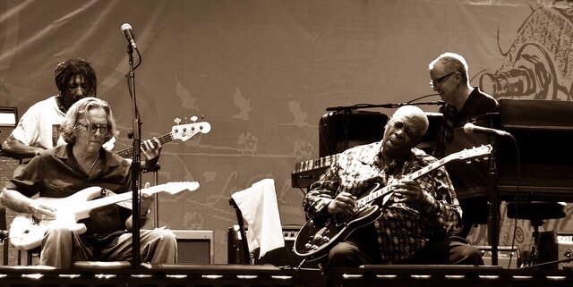 Eric Clapton and BB King, sitting down and playing guitar on stage. Photo courtesy of Aaron Warren from flickr.com