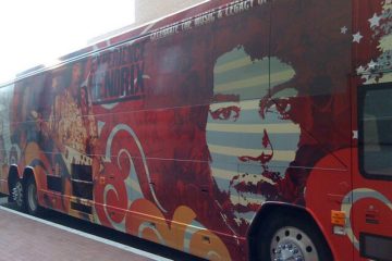 Jimi Hendrix red tour bus, outside on street. Photo courtesy of Jason Meredith from flickr.com