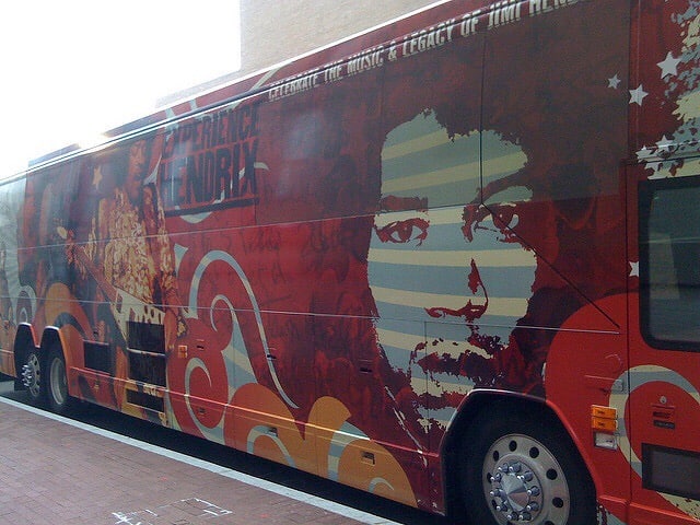 Jimi Hendrix red tour bus, outside on street. Photo courtesy of Jason Meredith from flickr.com