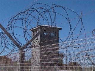 Prison with HUGE barbed wire on fence 