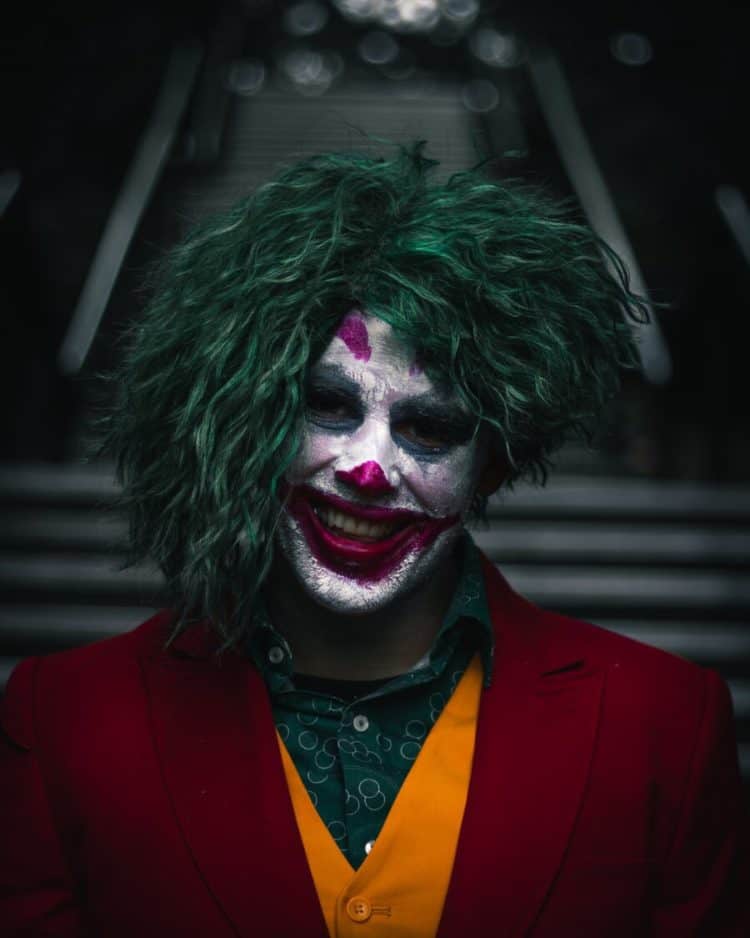 The JOKER smiling with a joker type smile.