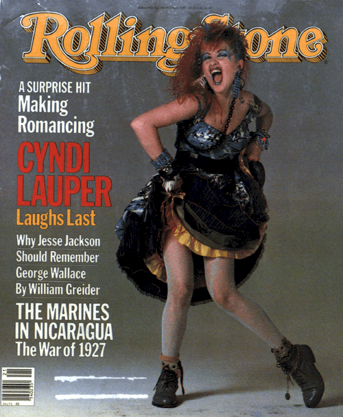 Cyndi Lauper on the cover of the Rolling Stone magazine with fancy elaborate dress on.