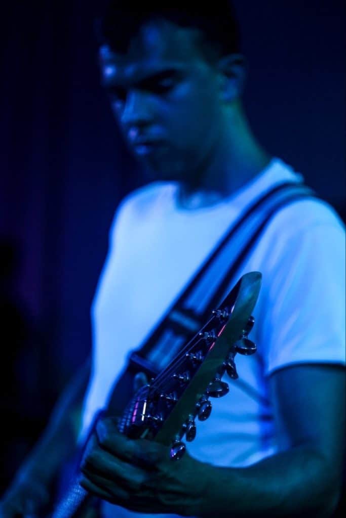 Young man playing the guitar, passionately!