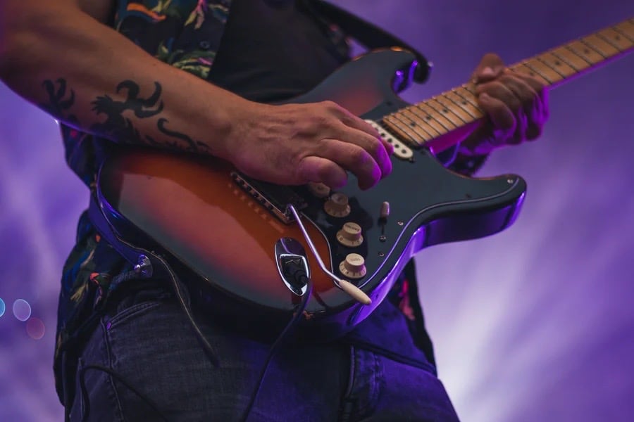 Musician playing a solo on guitar.